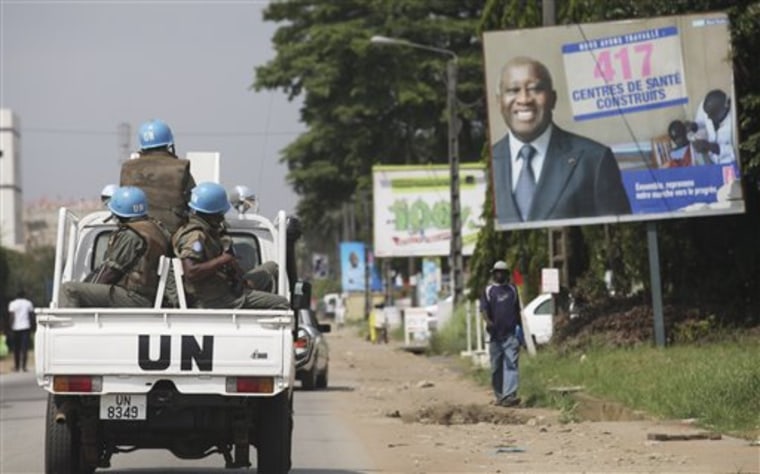 U.N. forces drive past a billboard for President Laurent Gbagbo in Abidjan, Ivory Coast on Dec. 23. The United Nations said Thursday that at least 173 people have been killed and dozens of others have gone missing or been tortured following Ivory Coast's disputed presidential election, which has prompted fears of a return to civil war.  